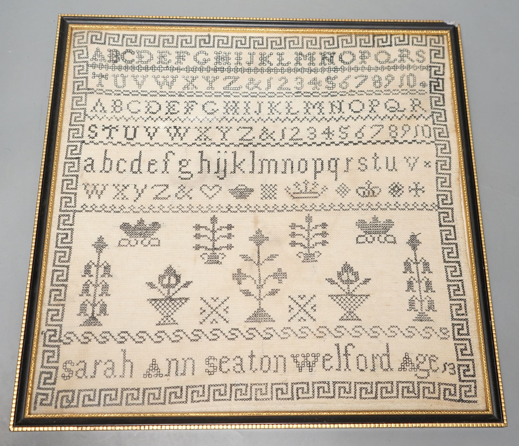 A framed Victorian alphabet sampler by Sarah Ann Seaton Welford, aged 13, 32x33cm